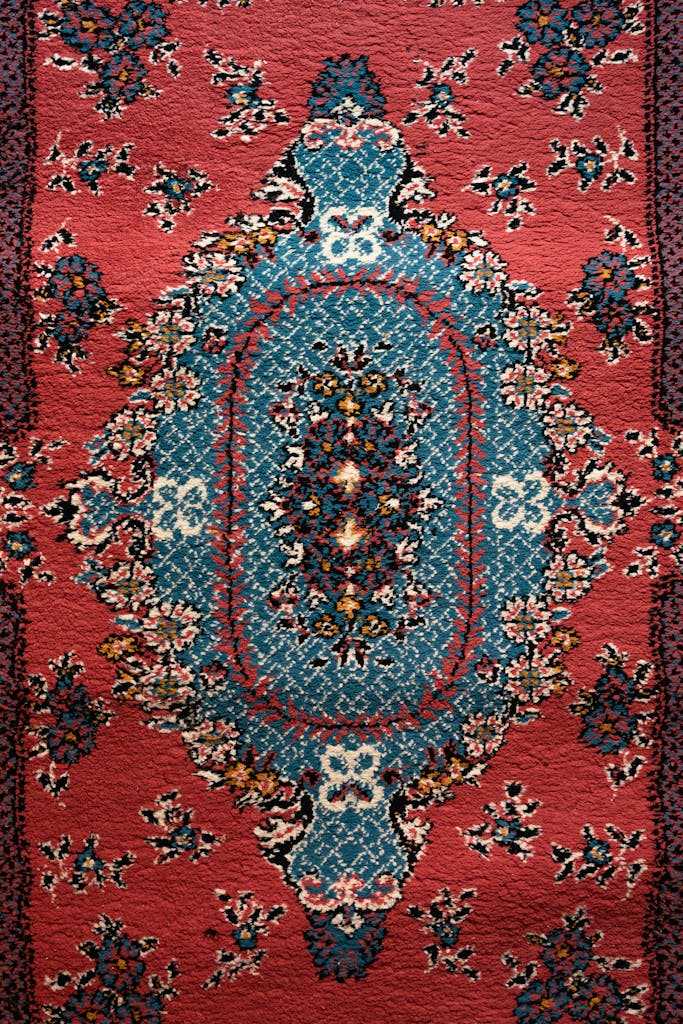A detailed and vibrant ornamental Persian rug with intricate designs and rich colors.